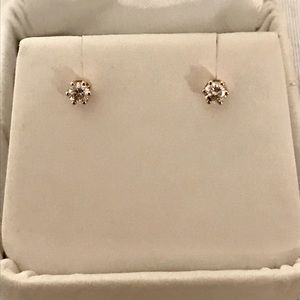 14k yellow gold diamond stud earrings.